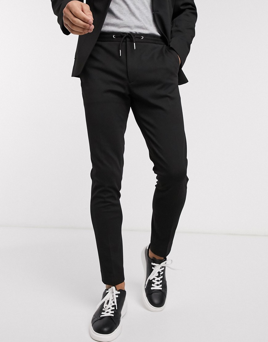 ASOS DESIGN - Pantaloni super skinny eleganti neri in jersey con coulisse in vita-Nero