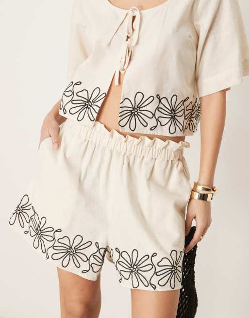 ASOS DESIGN paperbag waist embroidered hem shorts in stone - part of a set