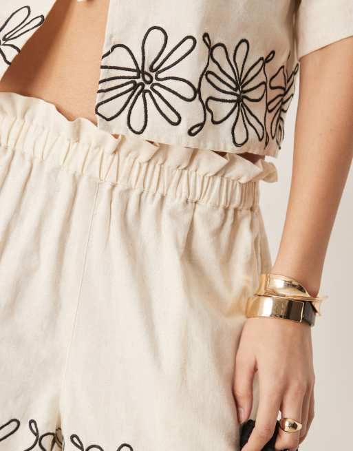 ASOS DESIGN paperbag waist embroidered hem shorts in stone - part of a set