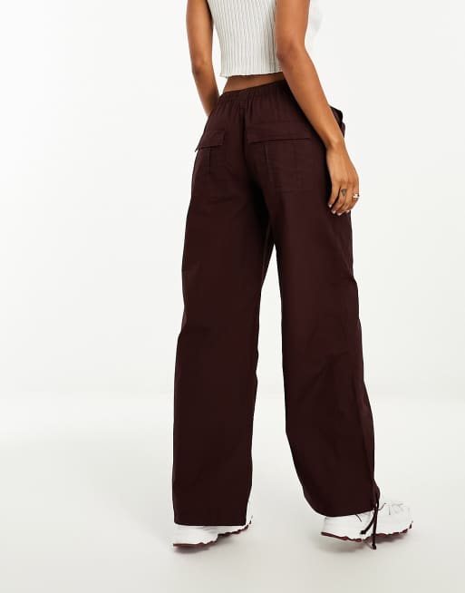 ASOS DESIGN parachute cargo pants with seam detail in dark red