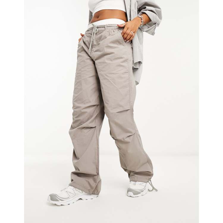 ASOS DESIGN parachute cargo pants with tie waist in washed stone