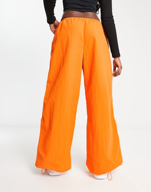 Orange cheap designer pants