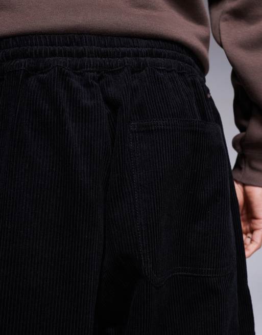 ASOS DESIGN parachute corduroy pants in black