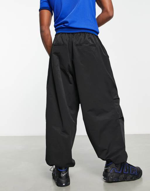 ASOS DESIGN parachute cargo pants in black leather look