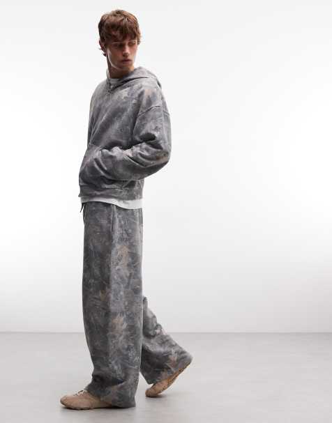 ASOS DESIGN - Parte de un conjunto - Joggers marrones extragrandes de corte globo con lavado y estampado de camuflaje - view 1