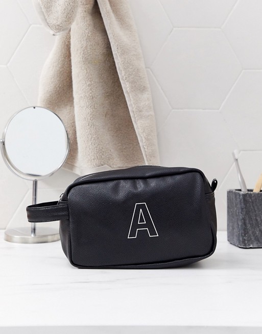 ASOS DESIGN personalised faux leather wash bag in black with 'A' initial