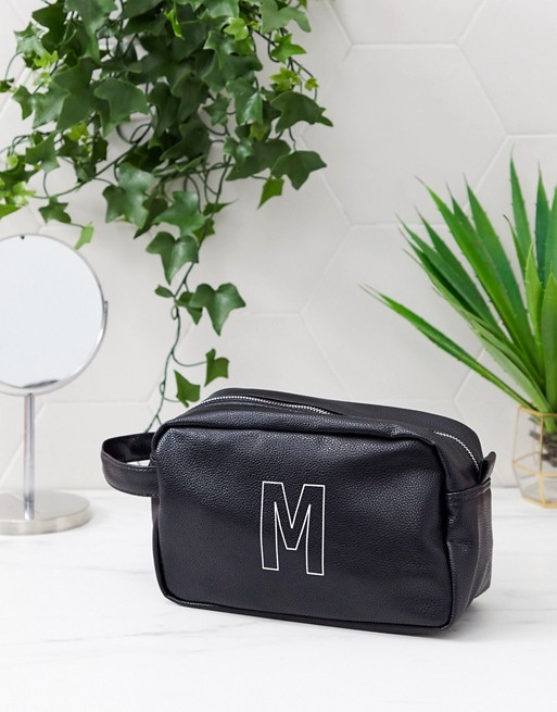 ASOS DESIGN personalised faux leather wash bag in black with 'M' initial