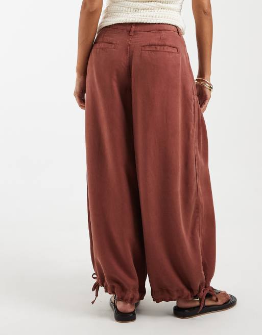 ASOS DESIGN Petite balloon pants with front pockets and adjustable tie hem in rust, 2 of 5