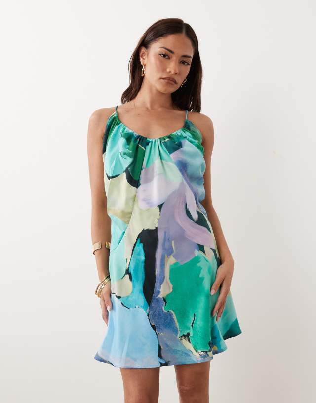 ASOS DESIGN Petite bias cut scoop neck low back satin mini dress in blue & red abstract floral