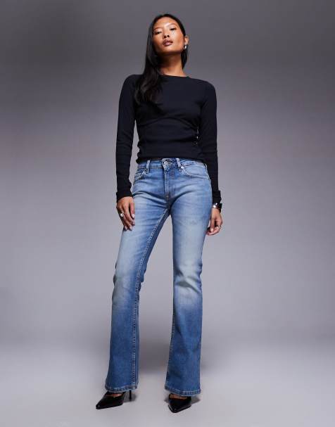 ASOS DESIGN Petite bootcut flare jeans in midwash