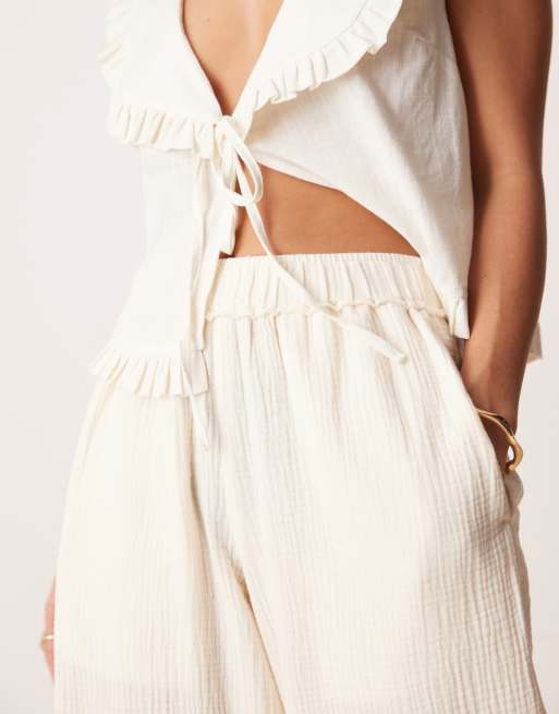 ASOS DESIGN Petite cheesecloth pull on pants with raw edge in buttermilk