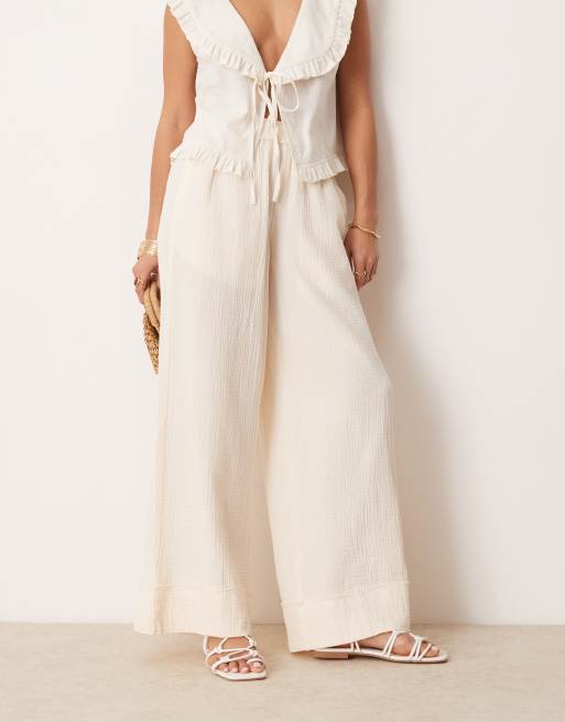 ASOS DESIGN Petite cheesecloth pull on pants with raw edge in buttermilk