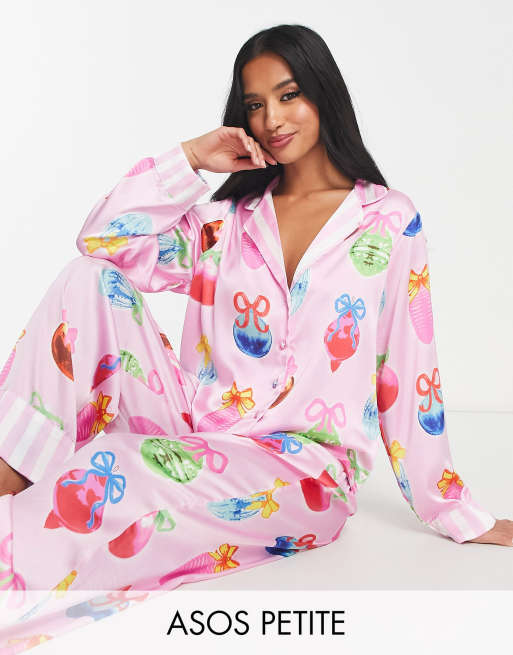 ASOS DESIGN Petite Christmas bauble satin shirt trouser pyjama set with contrast stripe cuffs in pink