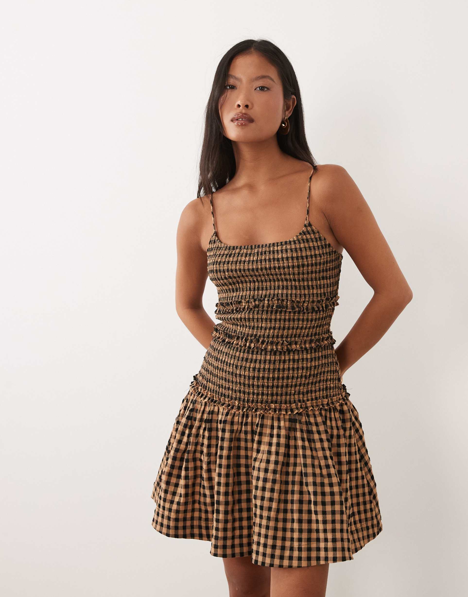 asos design petite crinkle mini dress with shirred dropped waist in navy and tan gingham