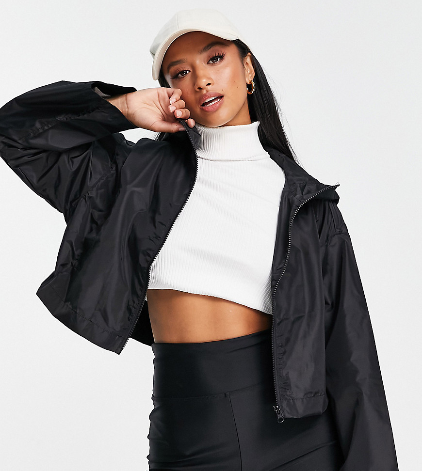 ASOS DESIGN Petite cropped recycled rain jacket with hood in black