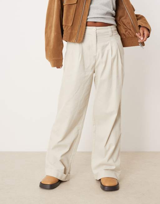 ASOS DESIGN Petite cuffed hem wide leg corduroy pants in cream
