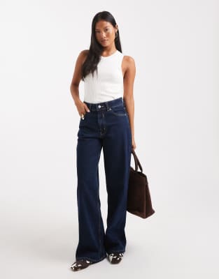 ASOS DESIGN Petite - Dad-Jeans mit weitem Bein in Rinse-Waschung-Marineblau