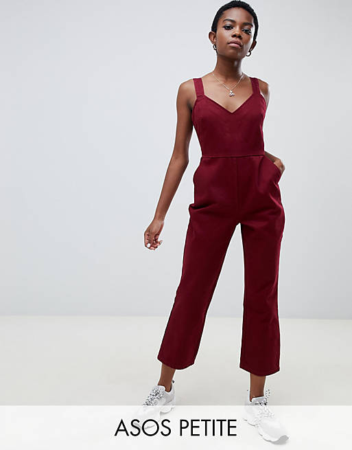 ASOS DESIGN Petite denim jumpsuit with kickflare in berry | ASOS