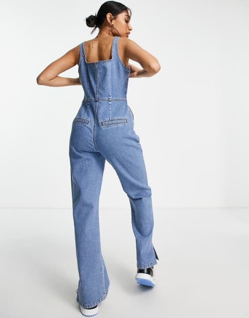 ASOS DESIGN Petite denim jumpsuit with puddle hem in midwash