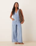 [ASOS Petite] ASOS DESIGN Petite denim sleeveless jumpsuit with tie back in lightwash blue 14 Light blue