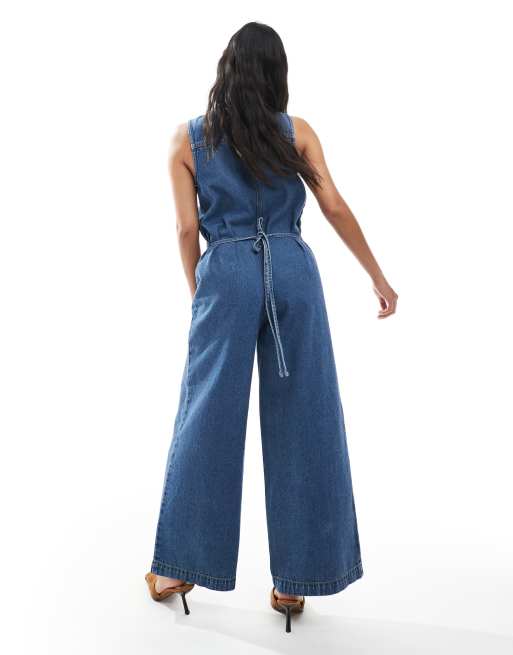 ASOS DESIGN Petite denim sleeveless loose jumpsuit in midwash blue