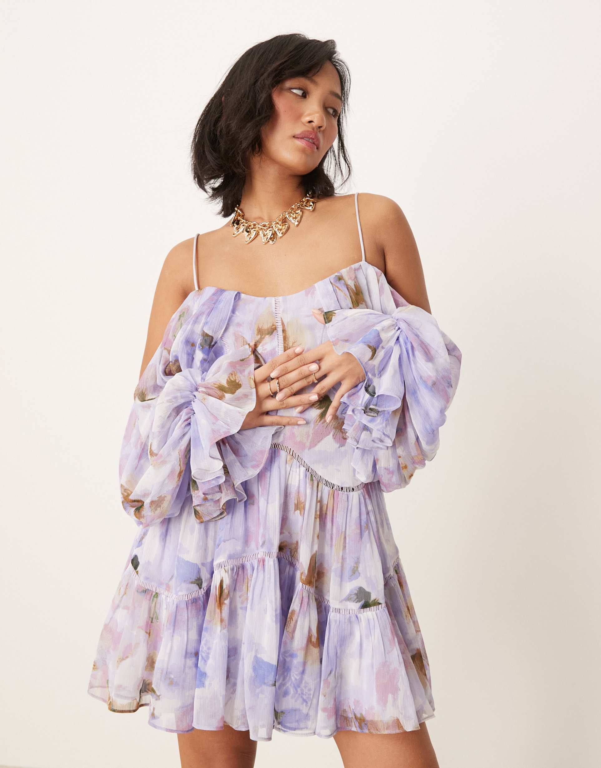 asos design petite draped off the shoulder tiered mini dress with lace inserts in blurred abstract