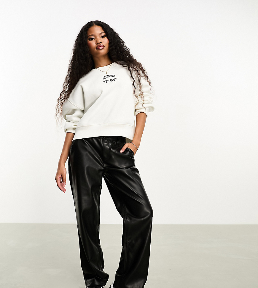 ASOS DESIGN Petite faux leather straight leg trousers in black