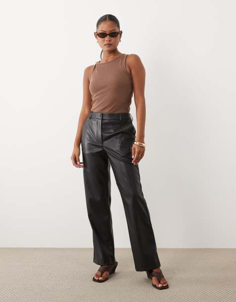 ASOS DESIGN Petite faux leather straight leg trousers in black - view 1