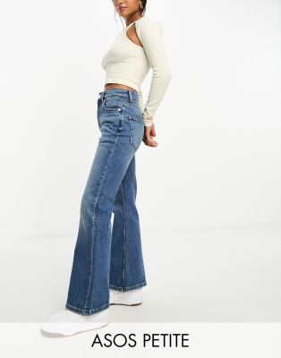 Asos Design Petite Flared Jeans In Mid Blue