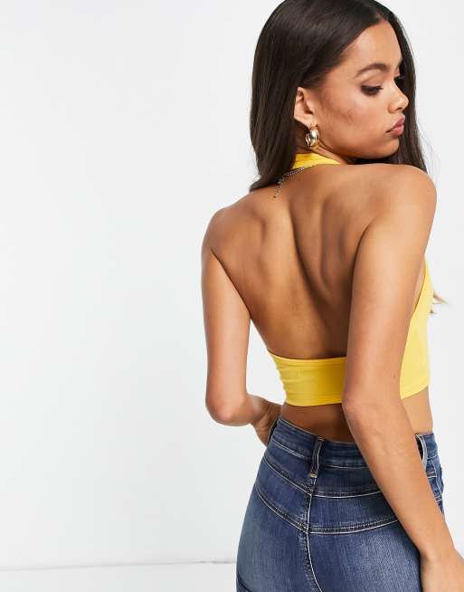 ASOS DESIGN halter cross neck crop top with button detail in light gold