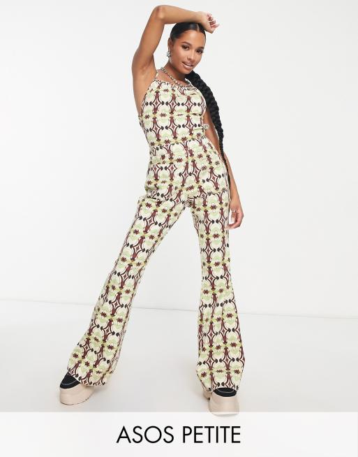 ASOS DESIGN Petite halter neck jumpsuit with flare leg in geo print