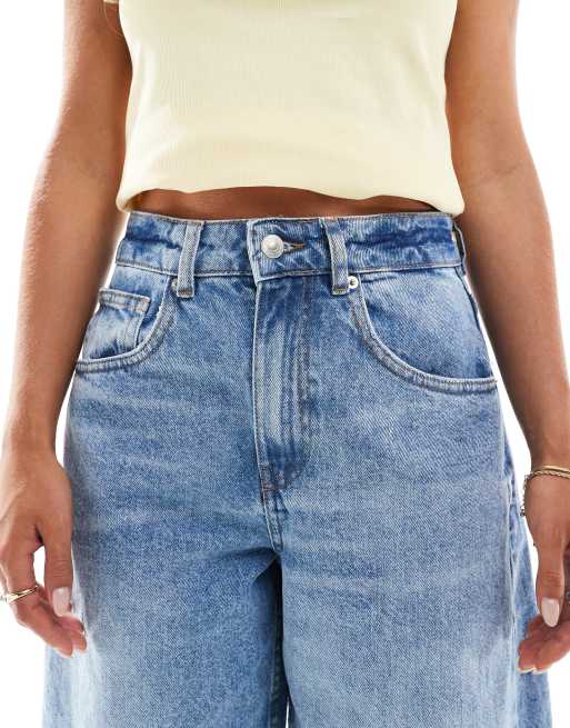 ASOS DESIGN Petite high rise barrel leg jeans in mid blue