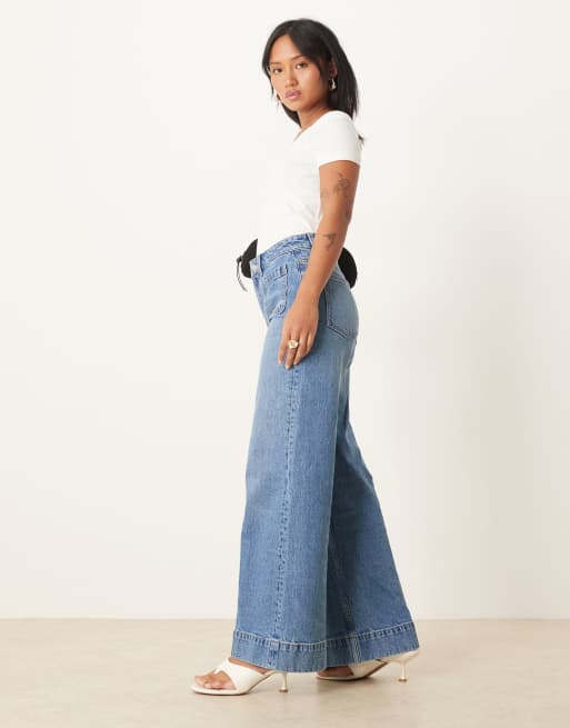 ASOS DESIGN Petite high rise wide leg jeans with front pockets in mid blue, 3 of 5