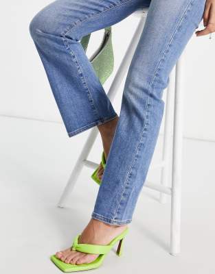 ASOS DESIGN Petite high rise 'Y2K' stretch flare jeans in midwash