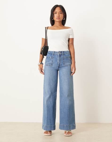 ASOS DESIGN Petite high waist wide leg jeans with front pockets in mid blue - view 1