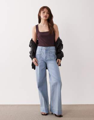 ASOS DESIGN Petite - Jean large à taille haute avec poches à l'avant - Bleu clair délavé 34