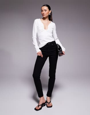 ASOS DESIGN Petite - Jean skinny - Noir épuré 34