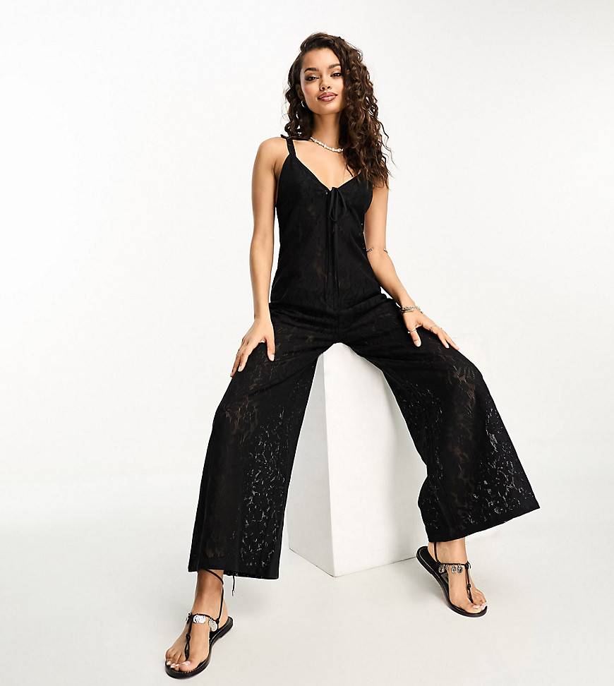 ASOS DESIGN Petite lace beach jumpsuit with cut out in black