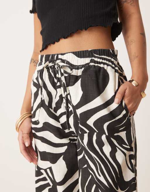 ASOS DESIGN Petite linen look pull on pants in spliced zebra print