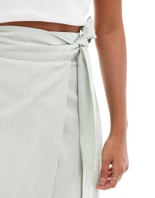 ASOS DESIGN Petite linen mix wrap detail midi skirt in sage green ASOS