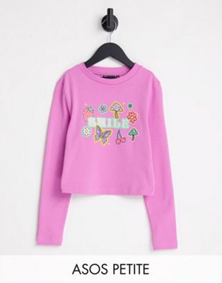 ASOS DESIGN Petite long sleeve baby tee with smile glitter graphic in pink