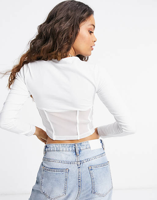ASOS DESIGN Petite long sleeve crop top with mesh corset detail in white