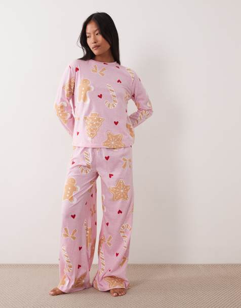 ASOS DESIGN Petite long sleeve top & wide leg trouser pyjama set with Christmas cookie graphic - view 1