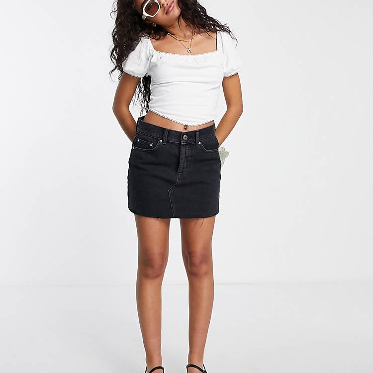 DESIGN Petite mid rise 'original' denim mini skirt in washed black | ASOS