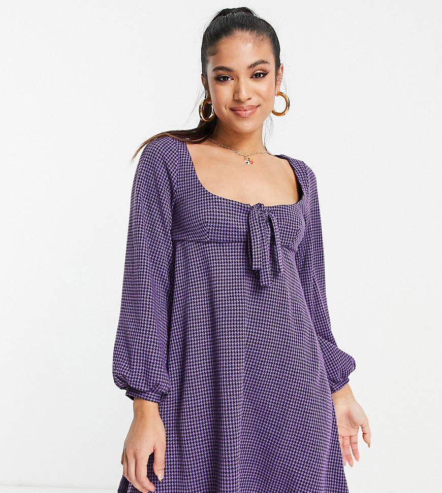 ASOS DESIGN Petite mini babydoll dress with tie detail and long sleeve in purple and black dogtooth print