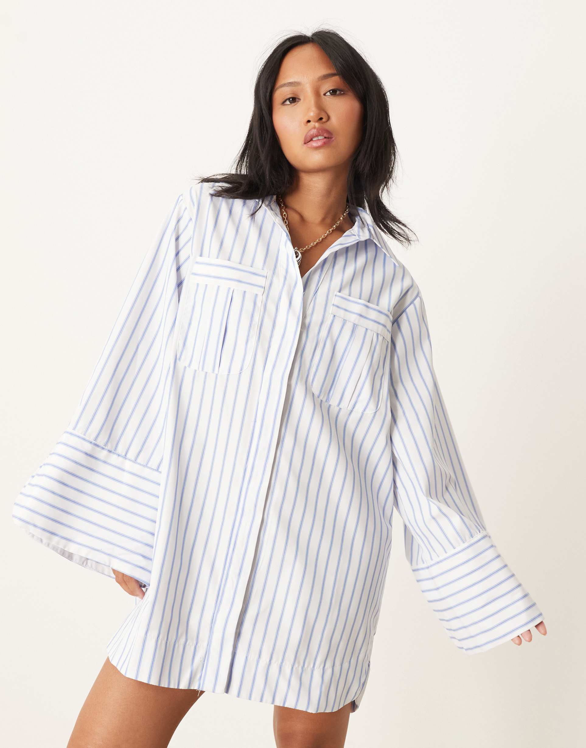 asos design petite mini shirt dress with wide cuffs and oversized pockets in blue stripe