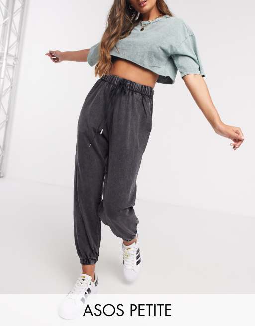 ASOS DESIGN Petite oversized acid wash sweatpants in black