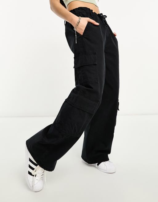 ASOS DESIGN Petite oversized cargo pants with multi pocket in black