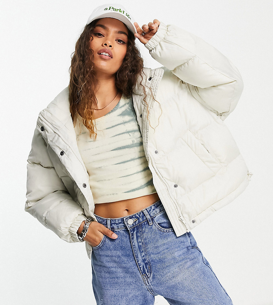 ASOS DESIGN Petite oversized recycled puffer jacket in cream-White