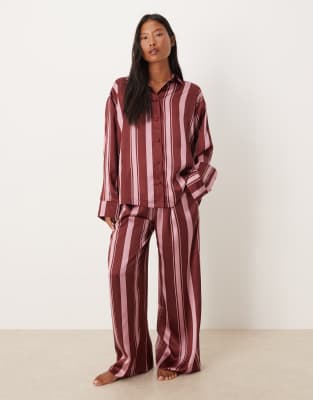ASOS Petite ASOS DESIGN Petite oversized satin stripe shirt and trouser pyjama set in burgundy stripe-Multi